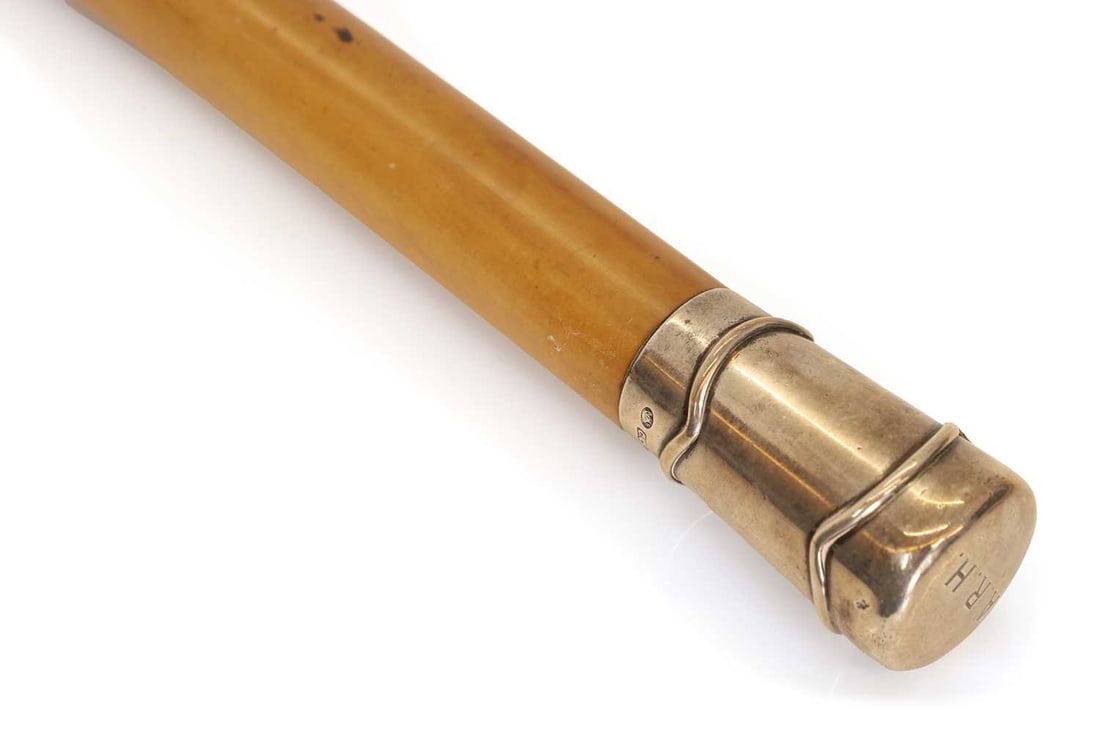 A silver-mounted walking cane makers mark C.C., London, 1910, stamped Brigg London, - 2