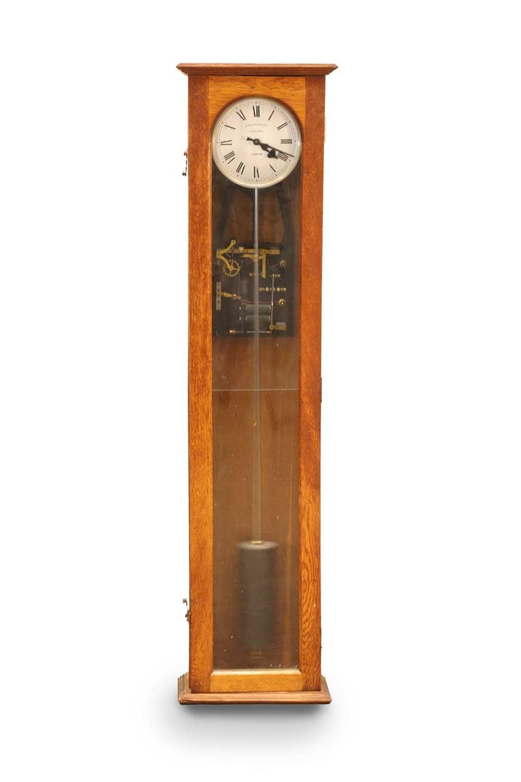 A Synchronome electric master clock, London, mid 20th century,: A Synchronome electric master clock, London, mid 20th century, the dial with Roman numerals signed Synchronome Electric London, the movement with gravity arm and twin coils visible behind the glazed