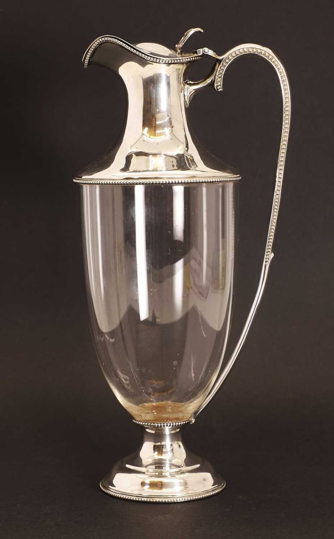 A silver mounted clear glass claret jug, (1 of 2)