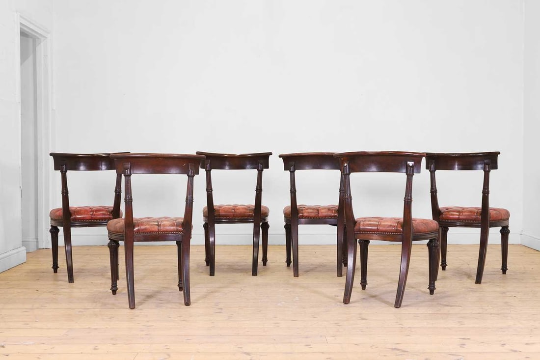 A set of six mahogany and buttoned-leather dining chairs, 19th century and later, - 3