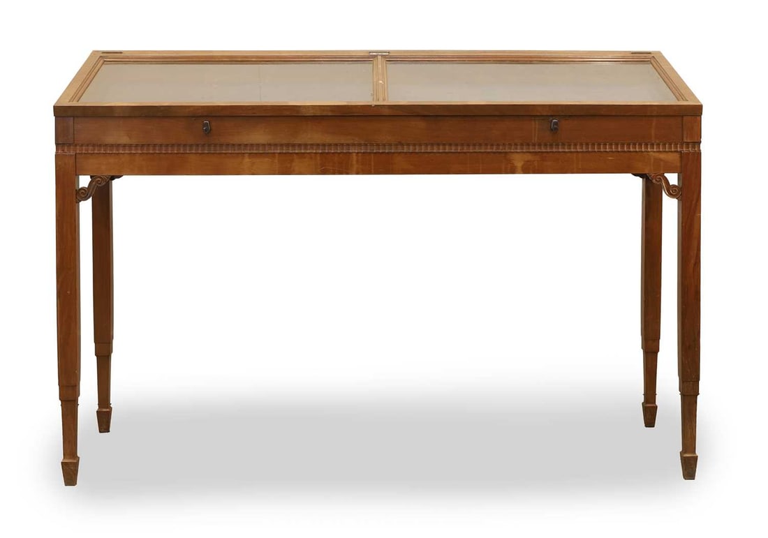 A walnut museum cabinet: A walnut museum cabinet Spanish, labelled 'Sals No 16', with a sloping top, fitted with two glass panels, the retainer biazed, with ribbon moulding, raised on square stepped supports, with scrolled sp