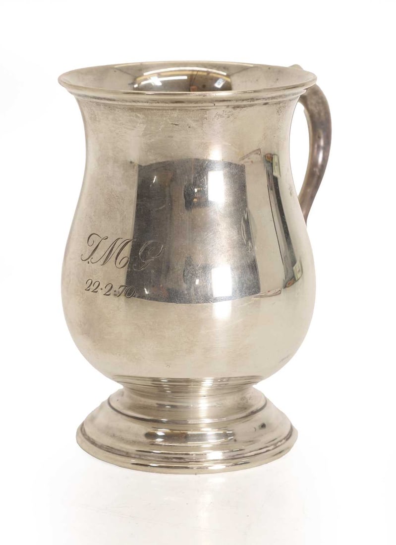 A silver tankard, (1 of 2)