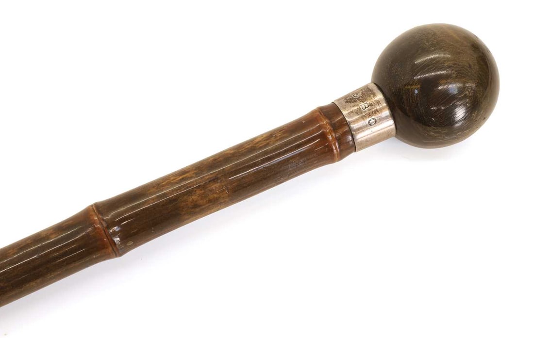 A horn and silver-mounted walking cane, makers mark C.C., London, 1909?, stamped Brigg London, - 2