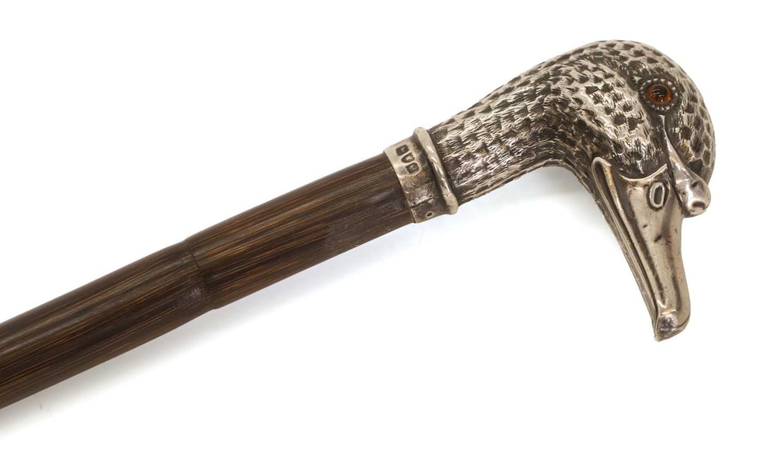 A silver-mounted duck's head walking cane, makers mark WD, London, 1900, - 2