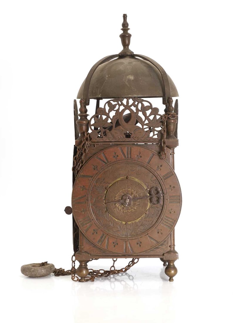 A brass lantern clock by Thomas Dyde, London, circa 1680,: A brass lantern clock by Thomas Dyde, London, circa 1680, the foliate-engraved Roman dial with a subsidiary 12-hour dial, surmounted by a domed cover and turned finials, raised on turned ball feet 15.
