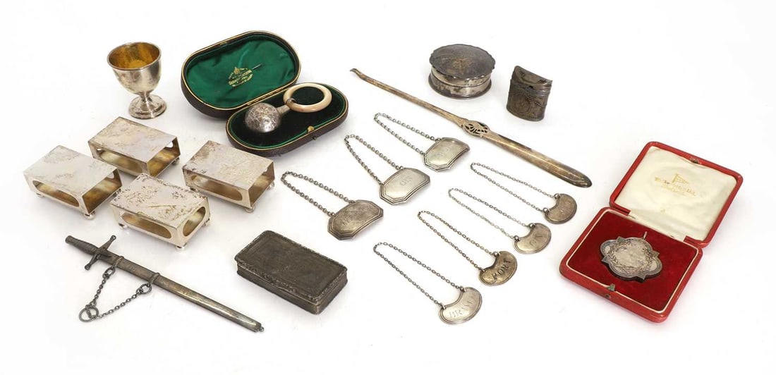 A collection of silver items,: A collection of silver items, to include a mother of pearl and silver teething ring and rattle by George Unite, Birmingham, 1890, with etched ginko leaf design, cased, a silver Walker & Hall