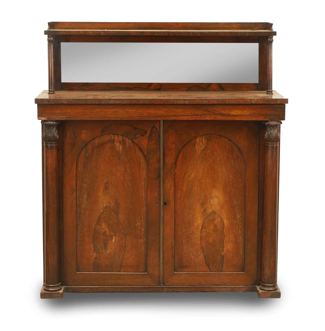 A Victorian rosewood chiffonier, late 19th century,: A Victorian rosewood chiffonier, late 19th century, the gallery top inset with mirrored back with turned supports, over two cupboard doors 98cm wide, 38cm deep, 109cm high Condition Report: The top