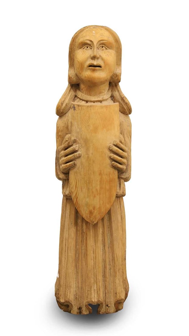 A carved pine figure, folk art,: A carved pine figure, folk art, woman with shield 22cm wide, 21cm deep, 75cm high