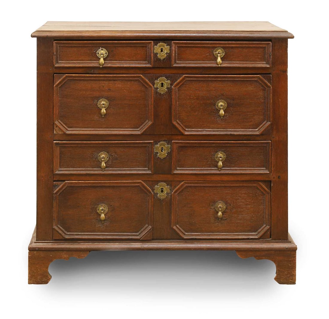 An oak geometric mould chest of four drawers, 18th century and later,: An oak geometric mould chest of four drawers, 18th century and later, with an arrangement of four long drawers with geometric moulding and drop handles 96cm wide, 58cm deep, 95.5cm high Condition