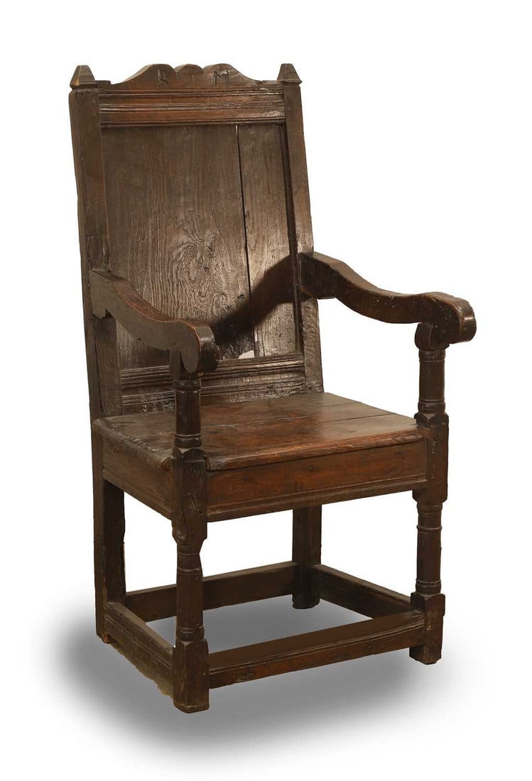 An oak Wainscot chair, 19th century and later,: An oak Wainscot chair, 19th century and later, initialled to the top rail, with scrolled supports 52cm wide, 53cm deep, 100cm high