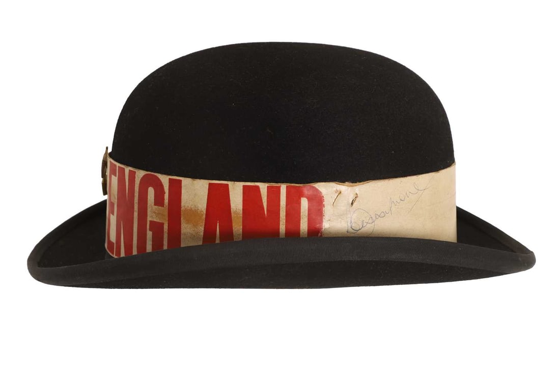 A bowler hat signed by Bobby Moore, circa 1970s,: A bowler hat signed by Bobby Moore, circa 1970s, the hat by Dunn & Co. Great Britain, the England band signed Bobby Moore 23cm wide, 13cm high Provenance: Signed in Prague on the 27th May 1973 whe