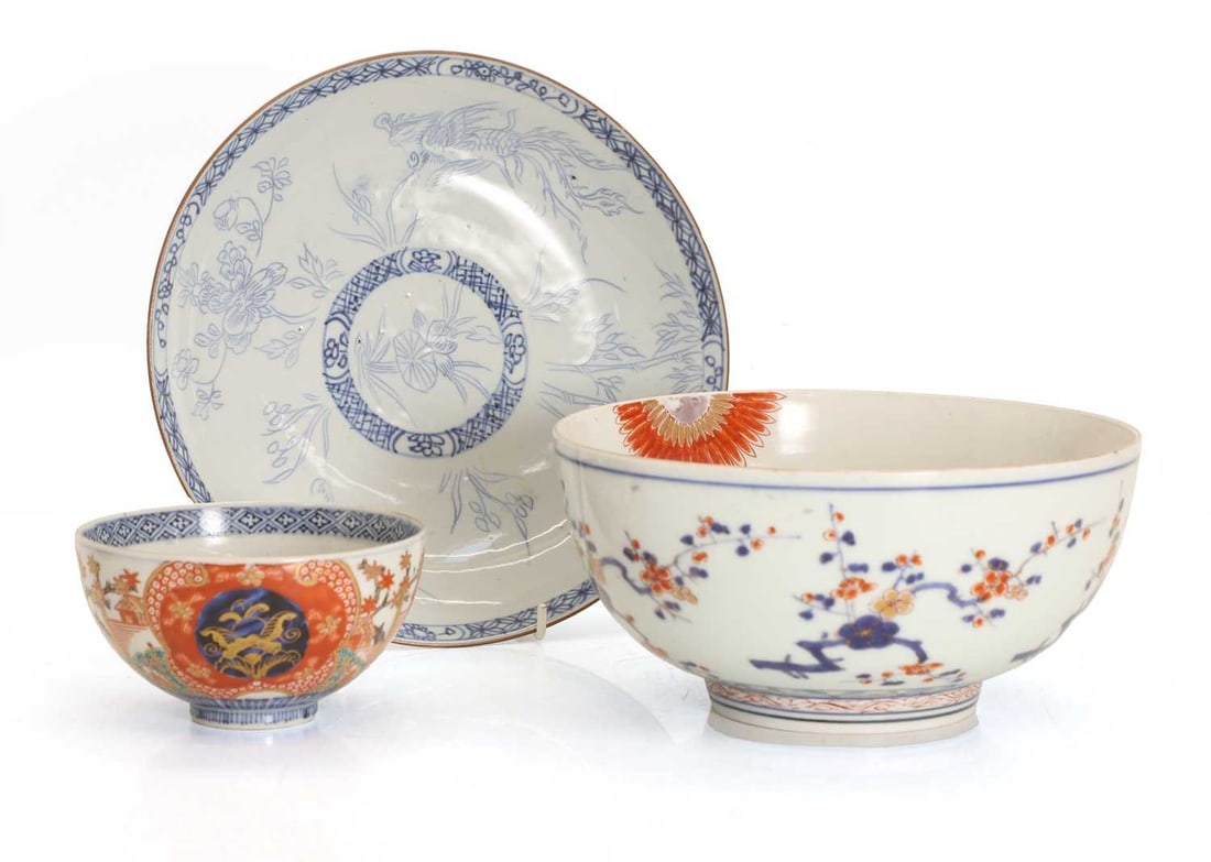 Two Japanese imari porcelain bowls, 18th century / 19th century,: Two Japanese imari porcelain bowls, 18th century / 19th century, each of circular form, the larger example painted with prunus blossom, the interior with chrysanthemum, the smaller similarly painted w