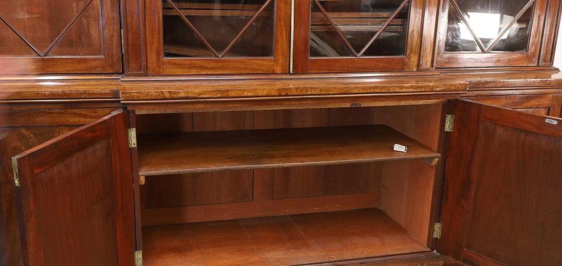 A George III mahogany library bookcase, early 19th century and later, - 2