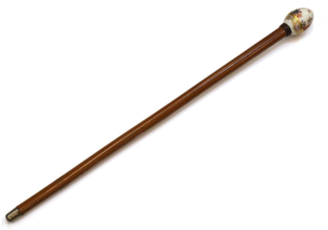 A Meissen-style porcelain egg-shaped handled walking cane, (1 of 2)