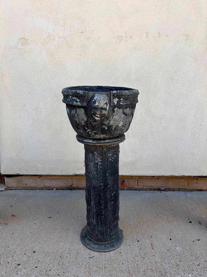 A lead jardinière and stand, circa 1900,: A lead jardinière and stand, circa 1900, with mask details, low relief details to the stand 32cm wide, 72cm high 2