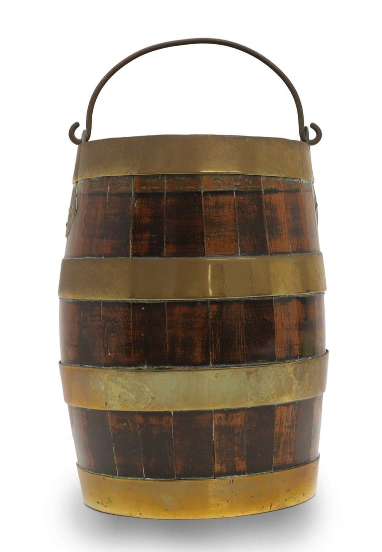 A small coopered oak barrel, 20th century,: A small coopered oak barrel, 20th century, with brass carrying handle and of traditional form 23cm wide, 29cm high