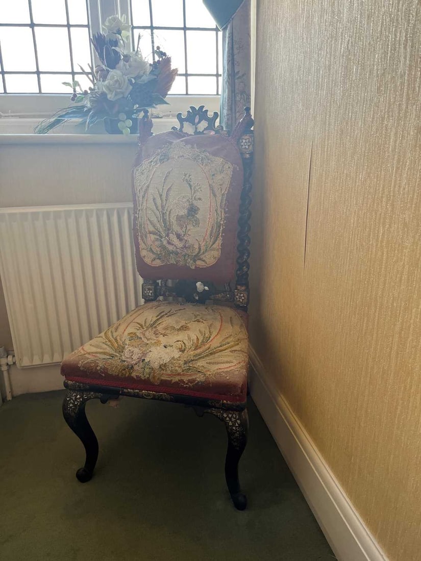 A Victorian ebonised and mother of pearl inlaid nursing chair, early 20th century,: A Victorian ebonised and mother of pearl inlaid nursing chair, early 20th century, with beadwork cushioned back and stuffover seat, and terminating in cabriole legs 48cm wide, 46cm deep, 96cm high