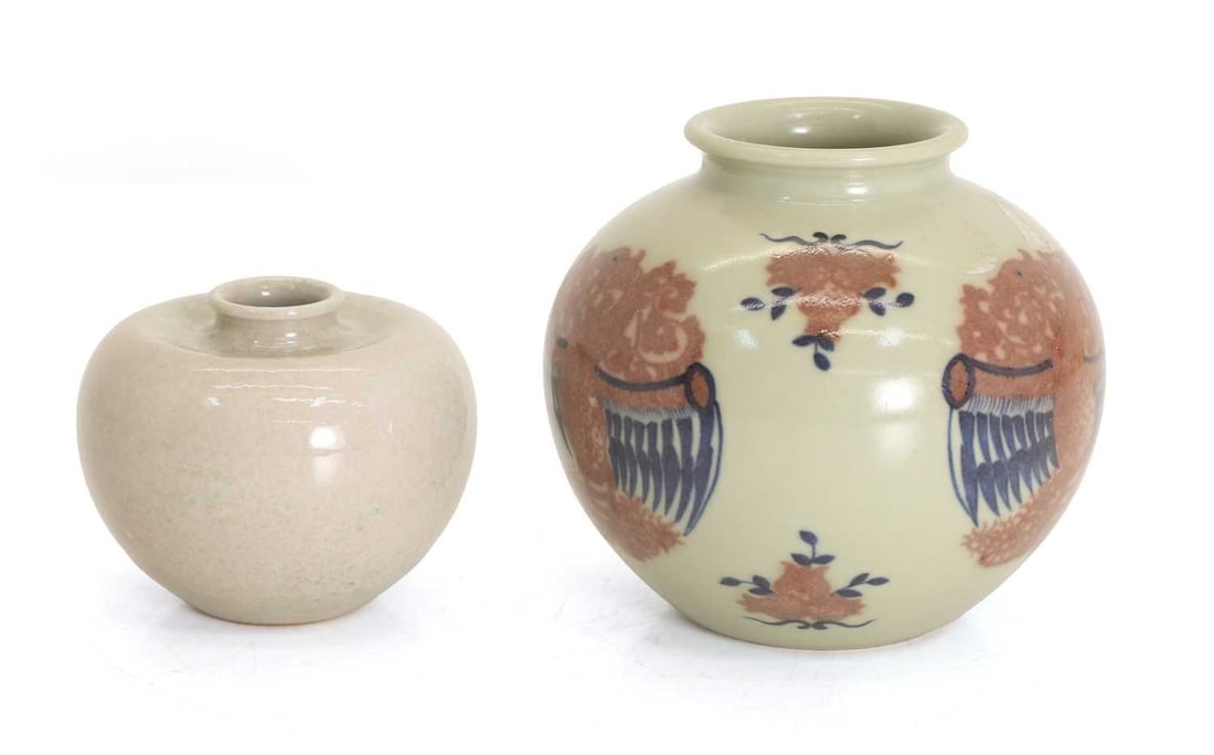 Two Chinese water pots,: Two Chinese water pots, each of short squat form, one example decorated in underglaze blue and copper red with dragons and pomegranates, the other with inverted shoulders and a white glaze, both beari