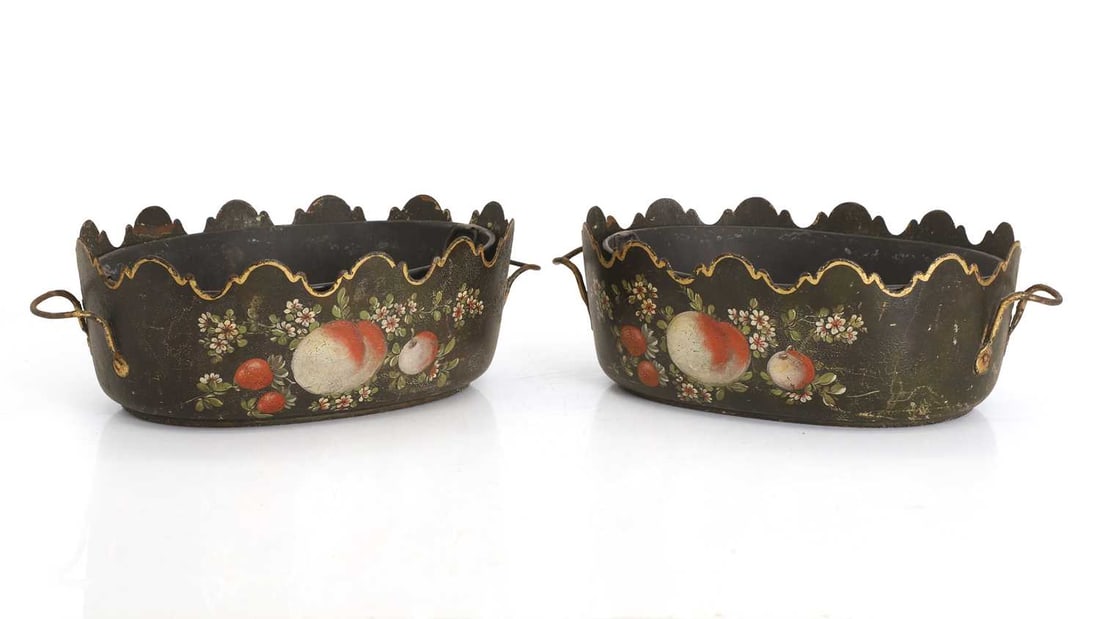 A pair of decorated toleware trays, 19th century,: A pair of decorated toleware trays, 19th century, steel, each with twin gilt decorated handles, a scalloped and decorated edge, with a gilt painted band, each side decorated with flowers with fruit