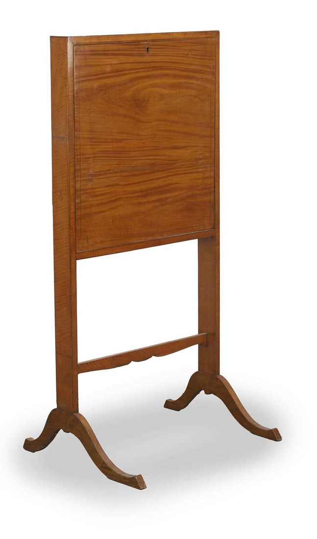 A satinwood secretaire folding desk, early 19th century,: A satinwood secretaire folding desk, early 19th century, opening to reveal a green leather writing pad, with gilt detailing, the back with dividers, over twin supports on shaped legs united by a