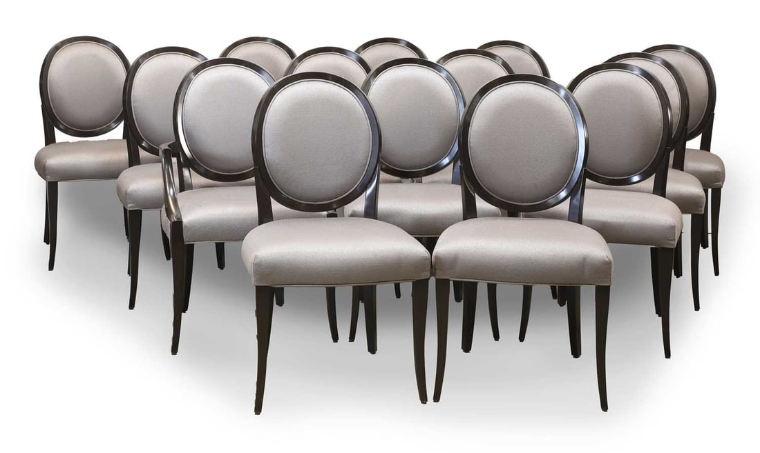 A set of oval-back dining chairs, of recent manufacture,: A set of oval-back dining chairs, of recent manufacture, comprising of fourteen examples, the ebonised frames, around grey upholstered base and back 60cm wide, 65cm deep, 96cm high 14 Condition