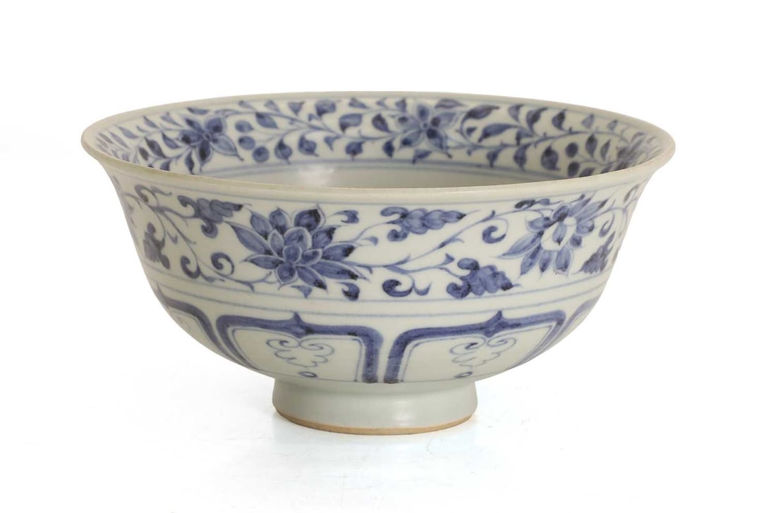 A Chinese blue and white bowl,: A Chinese blue and white bowl, of circular form with a slightly everted rim and raised on a short foot, the interior painted with an enclosed dragon chasing a pearl amongst clouds, within multiple
