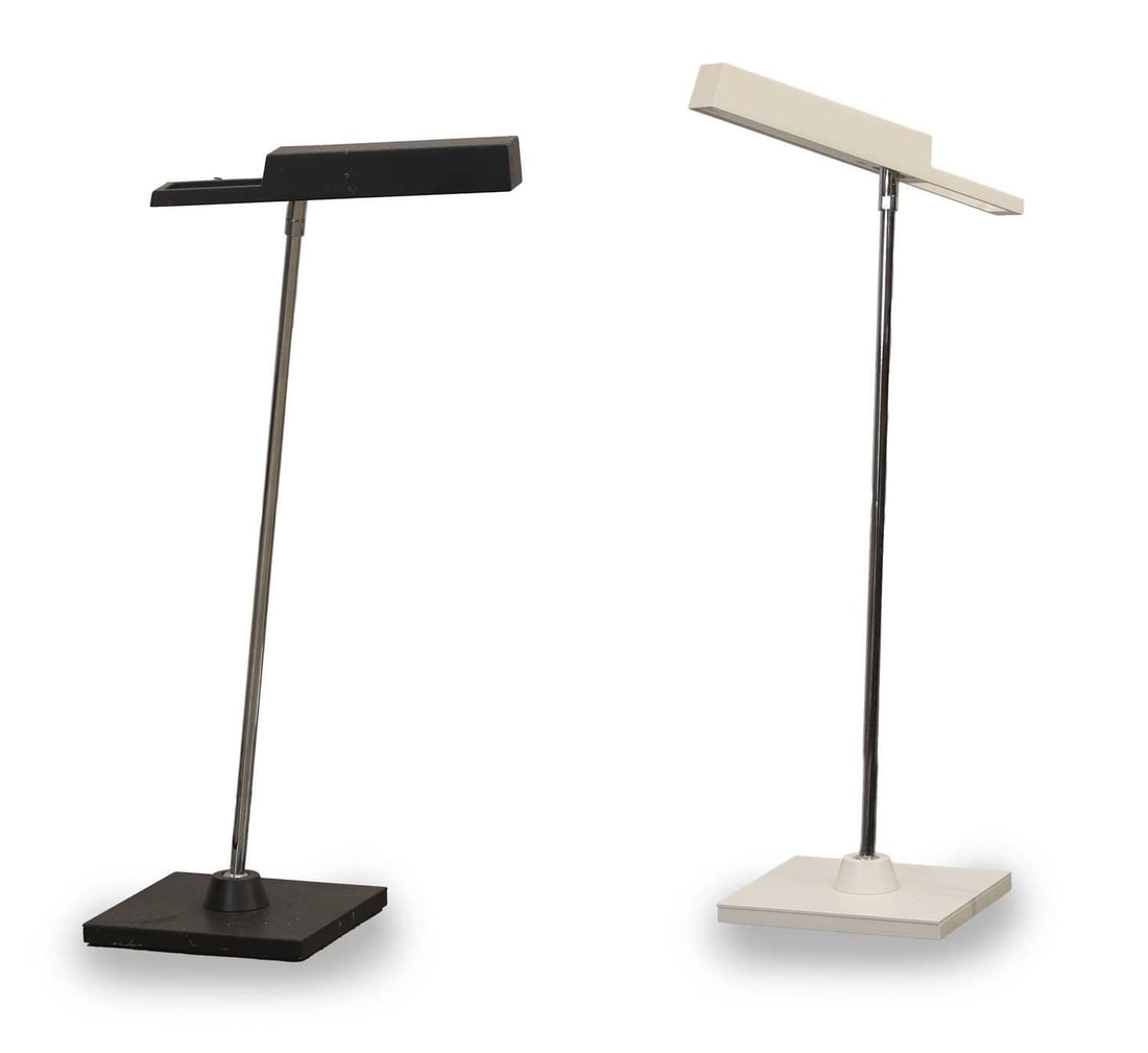 A pair of Bover 'Spock' desk lamps, of recent manufacture,: A pair of Bover 'Spock' desk lamps, of recent manufacture, one black one white, the rectangular shade over chrome support on a maneuverable spherical mount over a square soft touch base 25cm wide, 51c