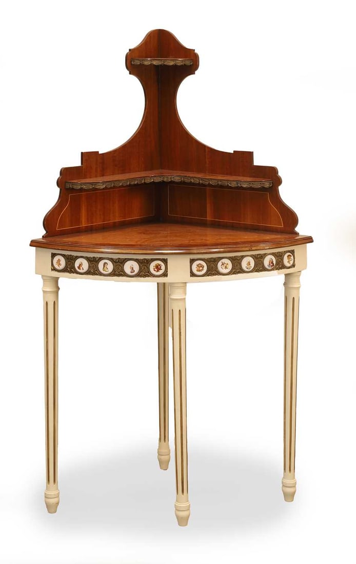 A French mahogany corner cabinet, early 20th century,: A French mahogany corner cabinet, early 20th century, the quarter elliptical top surmounted by two graduated shelves on turned white painted supports, and inlaid porcelain plaques decorated with