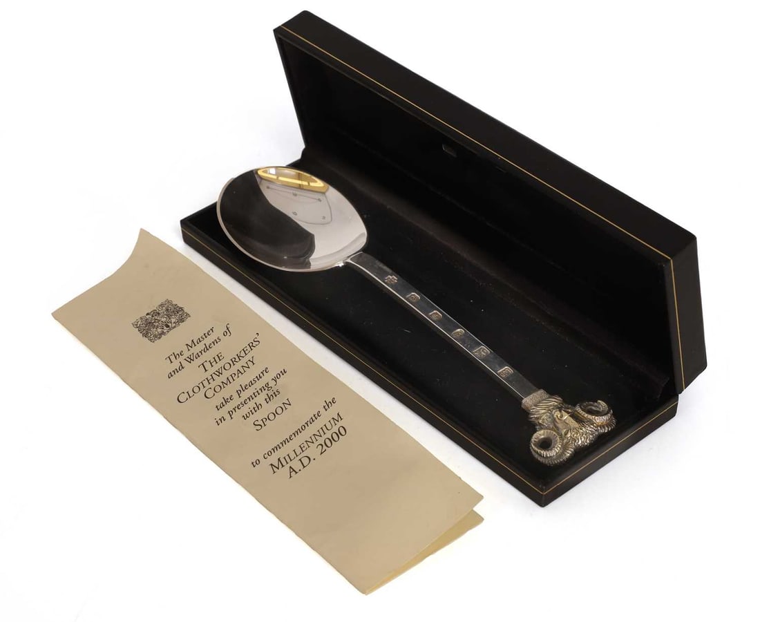 A silver commemorative Clothworkers Company presentation spoon,: A silver commemorative Clothworkers Company presentation spoon, by Leslie Durbin, London, 2000, with a gilt ram's head terminal, cased, with original paperwork 18.5cm long, 2.5ozt 3 Condition Report: