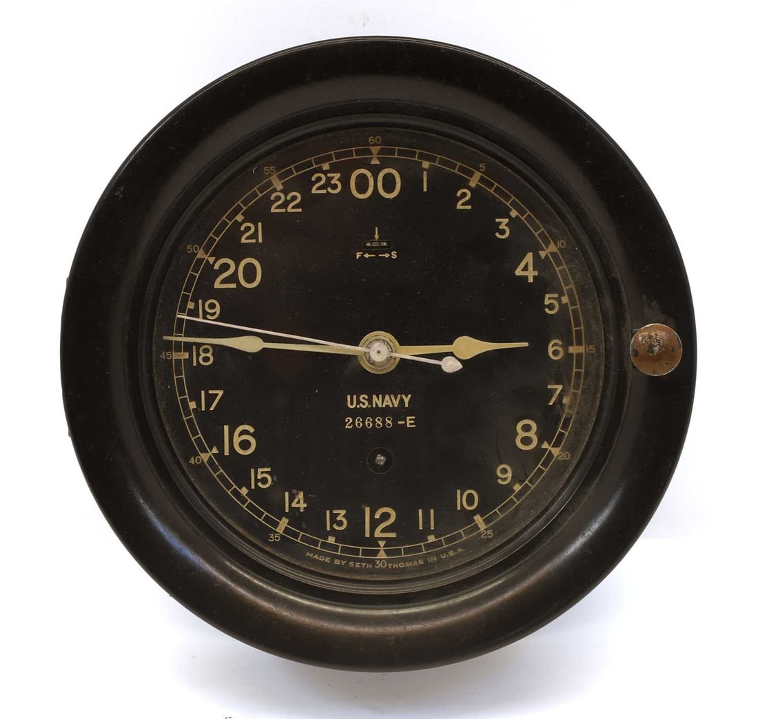 A World War II US Navy 24-hour bulk head clock, by Seth Thomas, (1 of 2)