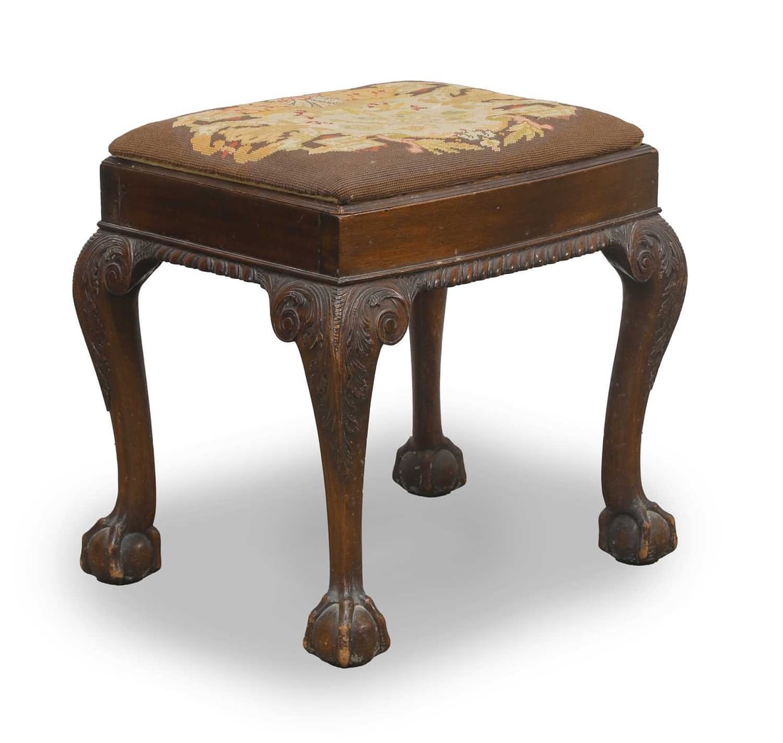 A George II style mahogany stool, 19th century,: A George II style mahogany stool, 19th century, on carved cabriole supports, descending onto ball and claw feet 43cm wide, 48cm high,