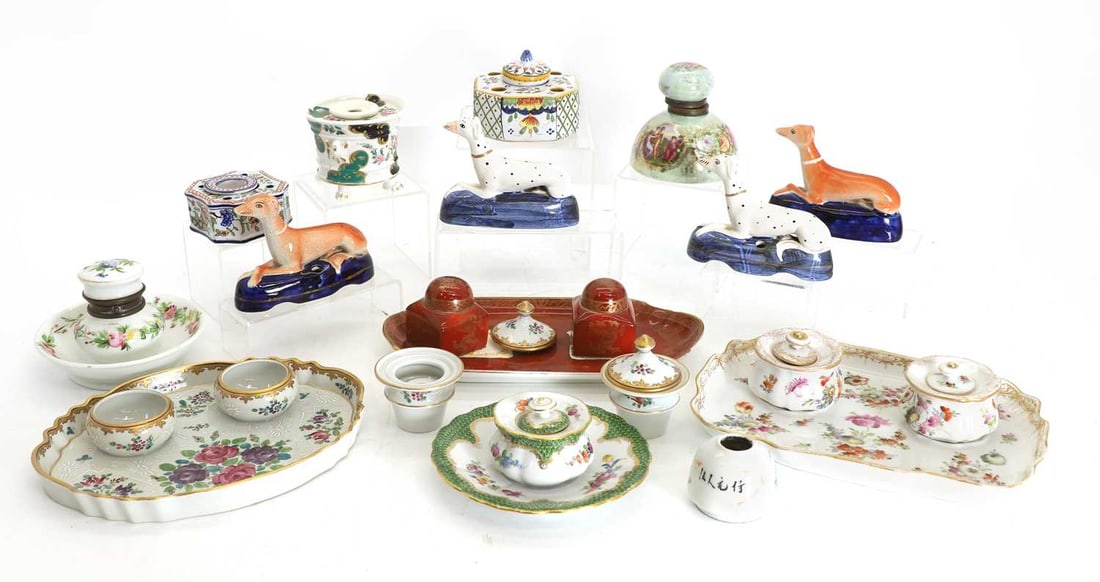 A continental porcelain foliate inkstand,: A continental porcelain foliate inkstand, together with a quantity of similar inkwells, a pair of Staffordshire style dogs, with blue bases, and another pair of Staffordshire style Dalmatians, etc.