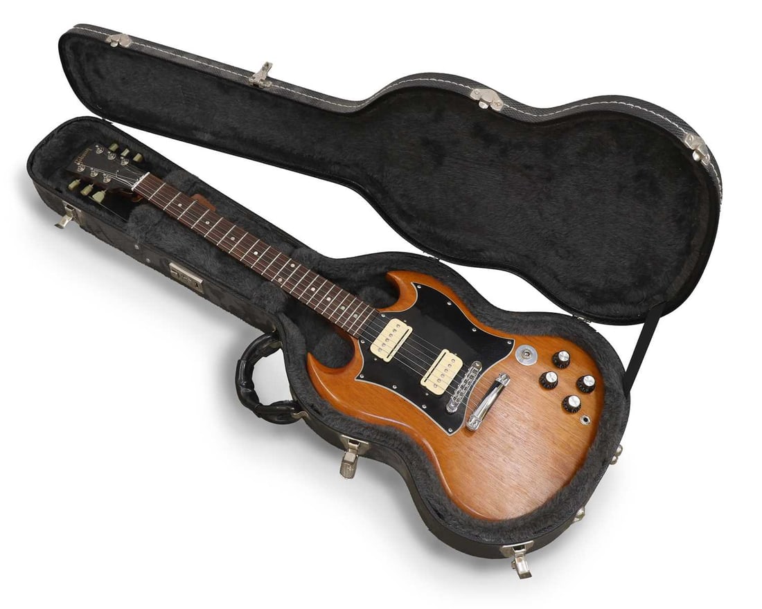 A Gibson SG Special Faded electric guitar,: A Gibson SG Special Faded electric guitar, serial no. 023090463, made in the USA, 2009, with a natural finish mahogany body and neck, twin humbucker pickups, Gibson Deluxe tuners, and contained in a