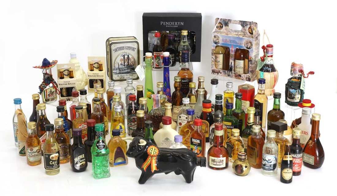 A crate of mixed miniature spirits,: A crate of mixed miniature spirits, to include: Midori, Pushkin Time Warp, Becherovka, Bacardi, Gran Marnier, etc. (qty.) Condition Report: As per image.