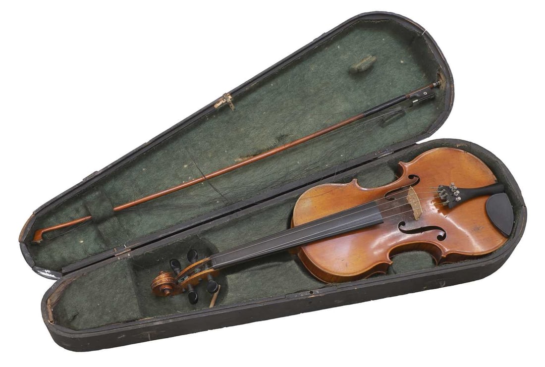 A cased violin, late 19th century,: A cased violin, late 19th century, one piece back and maple ribs, notched sound holes, ebony fingerboard and turners, with purfling lines, bears Stradivarius label dated 1715, with mother of pearl inl