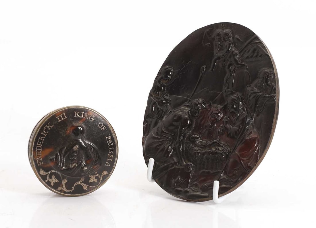Two cold-painted bronze miniature pugs and an oval French religious plaque, 20th century,: Two cold-painted bronze miniature pugs and an oval French religious plaque, 20th century, one modelled sat down, and stamped 'GESCHUTZ', in the style of Hans Bergman, and the other one stood and the
