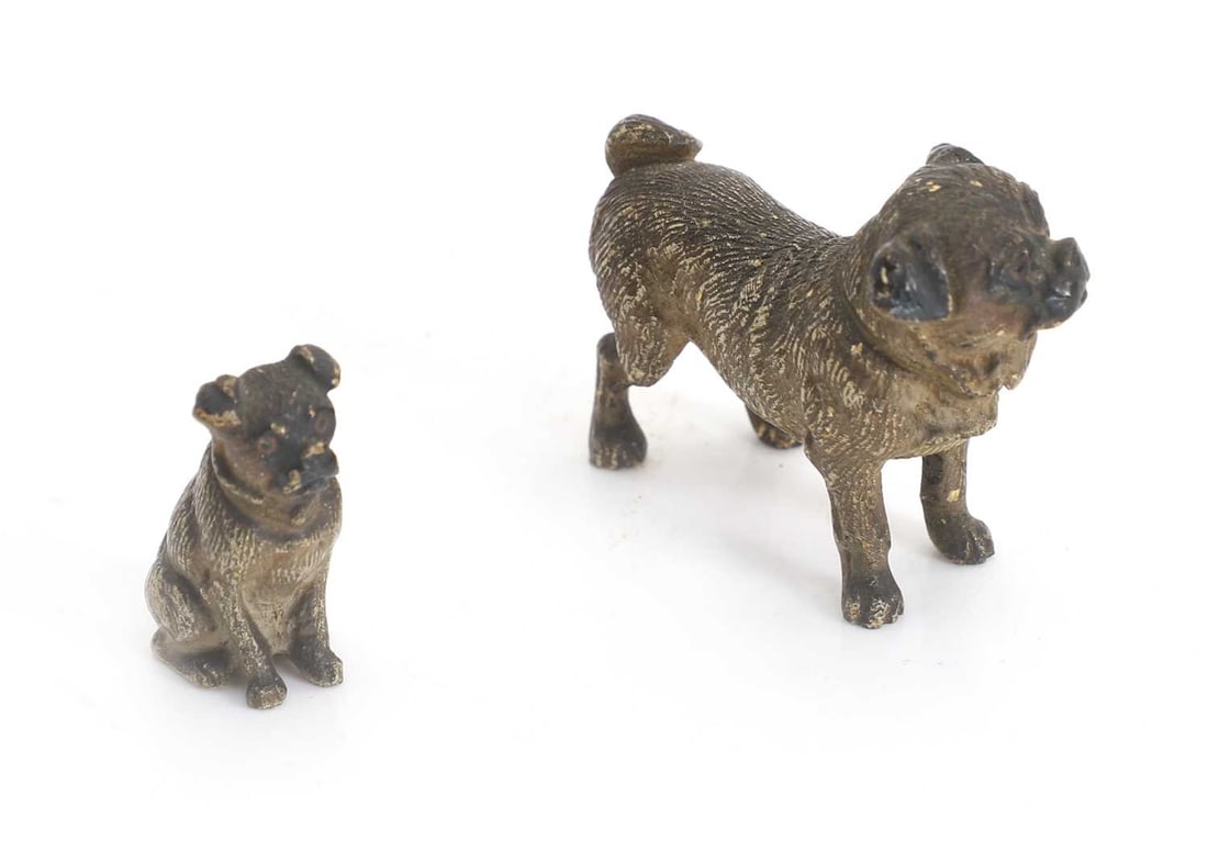 Two cold-painted bronze miniature pugs and an oval French religious plaque, 20th century, - 2