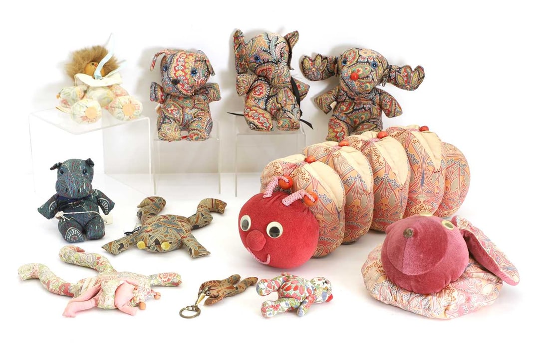A collection of Liberty toys,: A collection of Liberty toys, to include elephants, frogs, caterpillars, hippopotamus, etc., some with Liberty's label attached 36cm long (qty.)