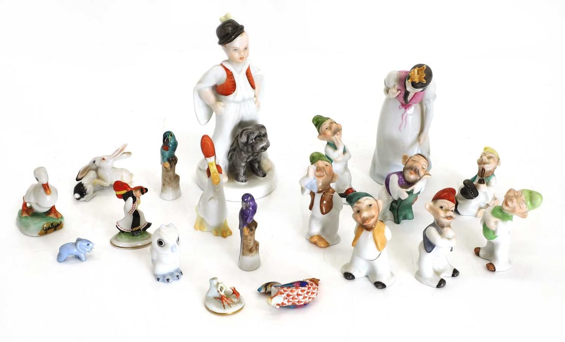 A collection of Herend ceramic animals,: A collection of Herend ceramic animals, to include Snow White and the Seven Dwarfs, two miniature parrots, an owl, a duck, a cockerel, damaged, etc. all with stamped marks to the bases The largest