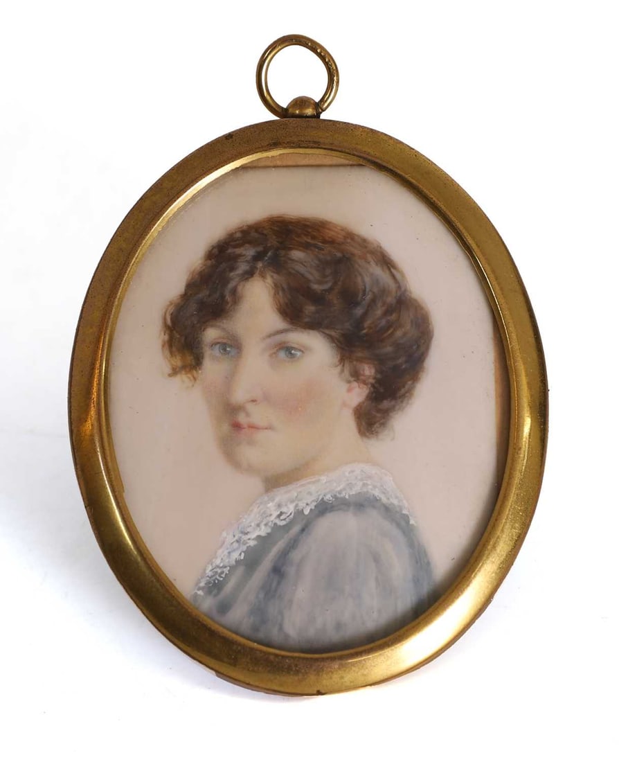 English School, circa 1910, Portrait of a lady,: English School, circa 1910, Portrait of a lady, oval, watercolour on ivory, in a brass frame, with ring suspension Ivory Declaration Submission Reference: 5CMJJHCJ Ivory - Important Information: This