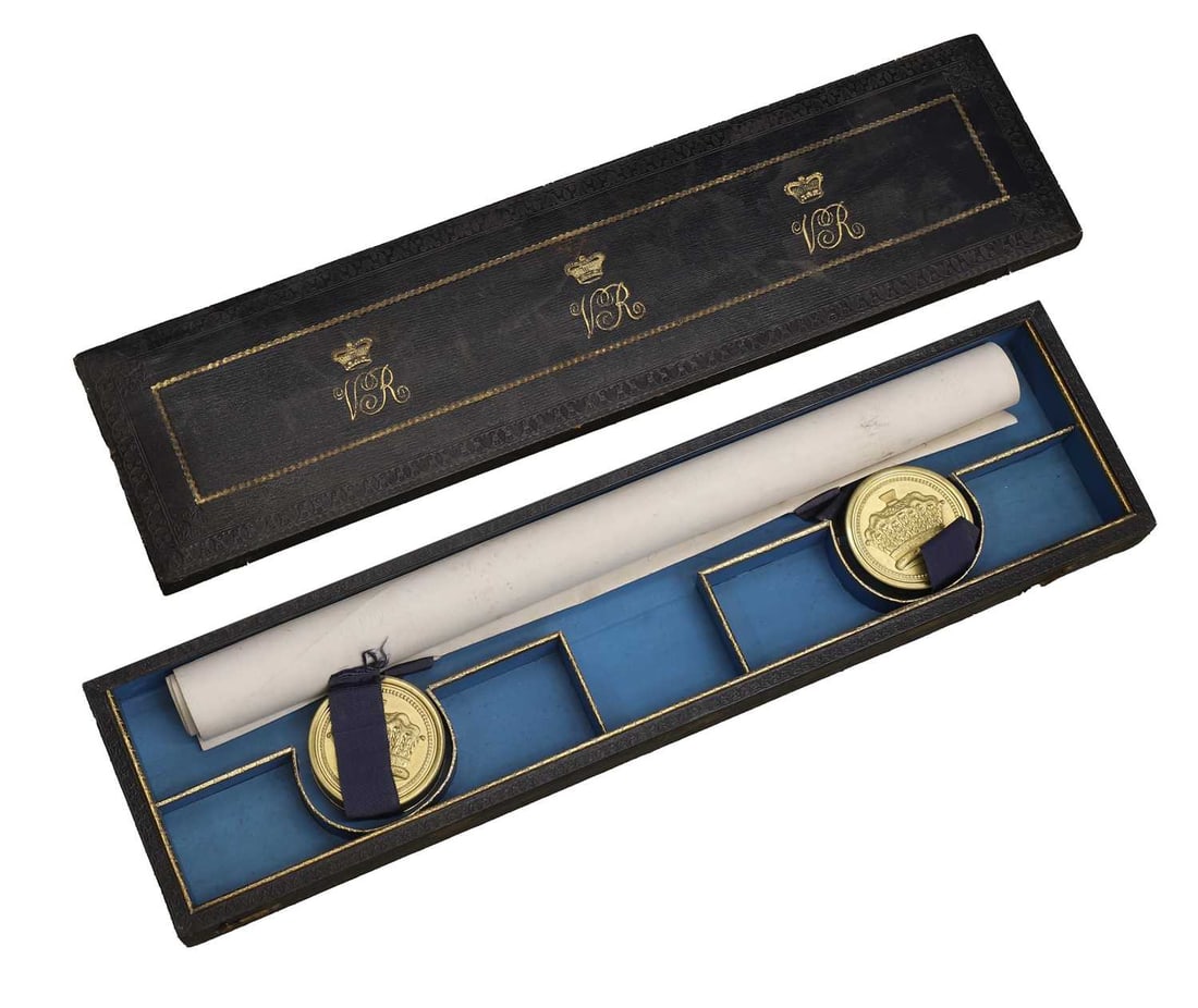 The Grant of Arms of Moses William Staples, dated 1843: The Grant of Arms of Moses William Staples, dated 1843 the illuminated vellum letters patent bearing the armorial achievement of Moses William Staples, with seals and signatures, contained in an