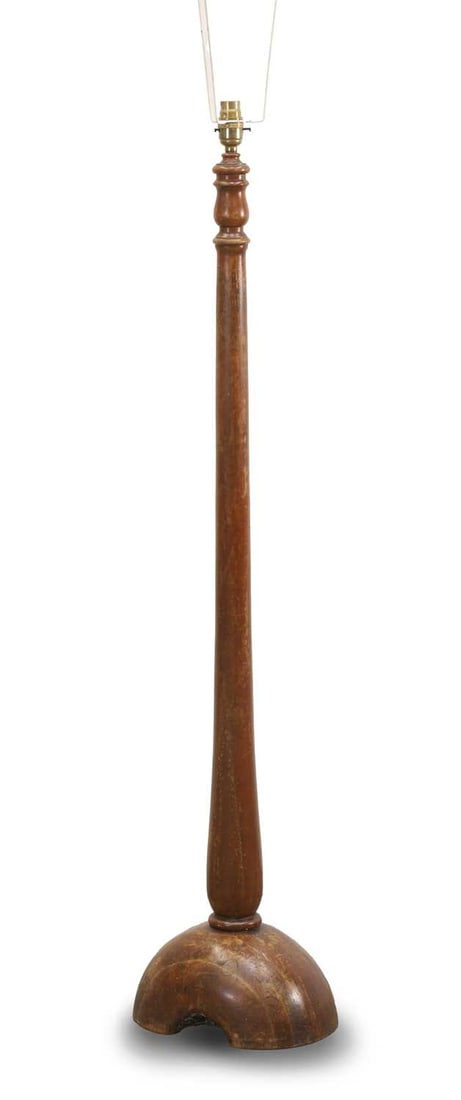 An unusual turned standard lamp, 19th century,: An unusual turned standard lamp, 19th century, the arched block base, and turned colomn 25cm wide, 116cm high Condition Report: We cannot guarantee the full working order of this item and would