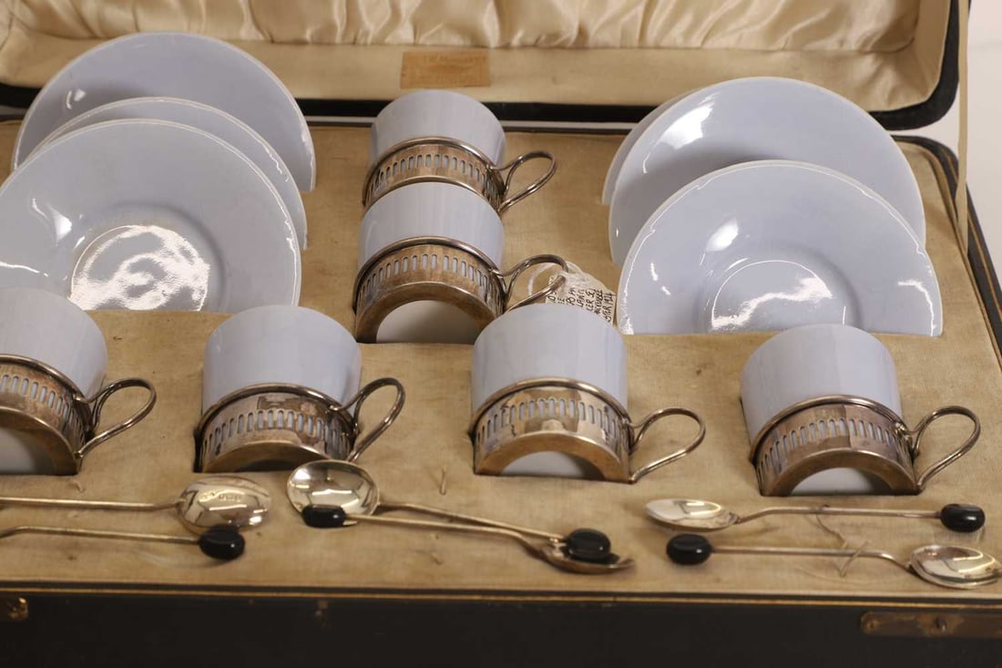 Two cased silver mounted porcelain coffee services, early 20th century, - 2