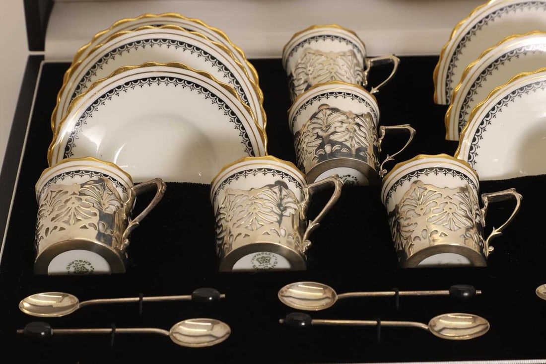 Two cased silver mounted porcelain coffee services, early 20th century, - 3