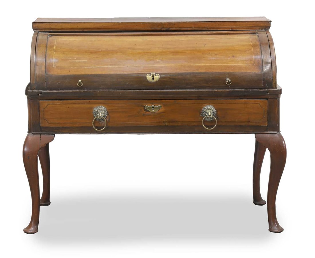A mahogany cylinder bureau, late 19th century,: A mahogany cylinder bureau, late 19th century, the front opening to reveal a fitted interior, the single long drawer with lion mask ring pull handles, over cabriole legs 118cm wide, 58cm deep 94.5cm
