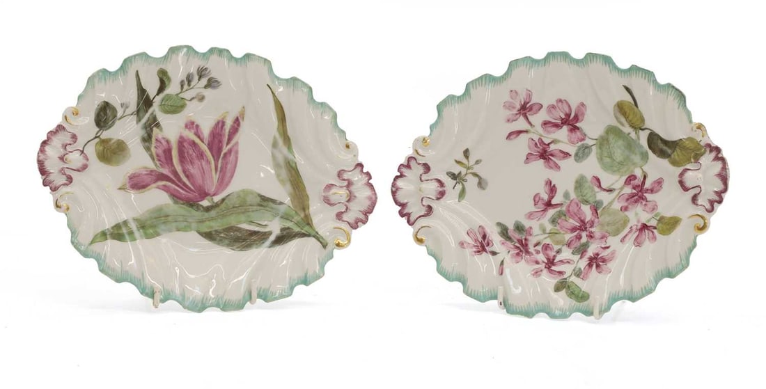 A pair of shaped moulded porcelain dishes, circa 1760, Chelsea or Derby,: A pair of shaped moulded porcelain dishes, circa 1760, Chelsea or Derby, each painted with flowers, within a turquoise feuille de choux border, both with red anchor marks 25.5cm long 2 Condit