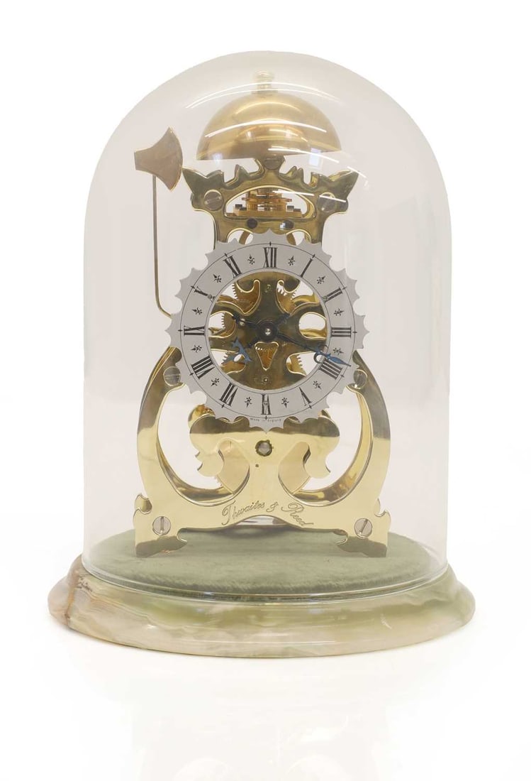A Thwaites & Reed Athenase skeleton clock,: A Thwaites & Reed Athenase skeleton clock, the skeleton mechanism encased in oynx stype stone and glazed dome, with paperwork, numbered 319/1000 14cm wide, 20cm high