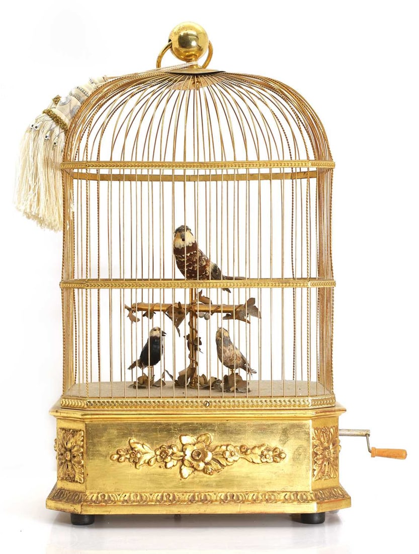 A Swiss automaton singing birdcage, 20th century,: A Swiss automaton singing birdcage, 20th century, by Reuge Music Saint-Croix Switzerland, having three birds to the interior perched upon a brass pole with faux ivy decoration, within a gilt