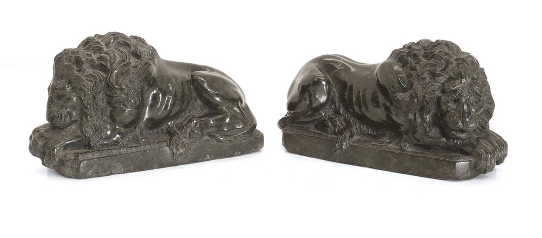 A pair of Italian serpentine Grand Tour lions, late 19th century,: A pair of Italian serpentine Grand Tour lions, late 19th century, each after Antonio Canova (1757-1822), of recumbent form 19cm wide, 6.5cm deep, 10cm high 2 Condition Report: one with lo