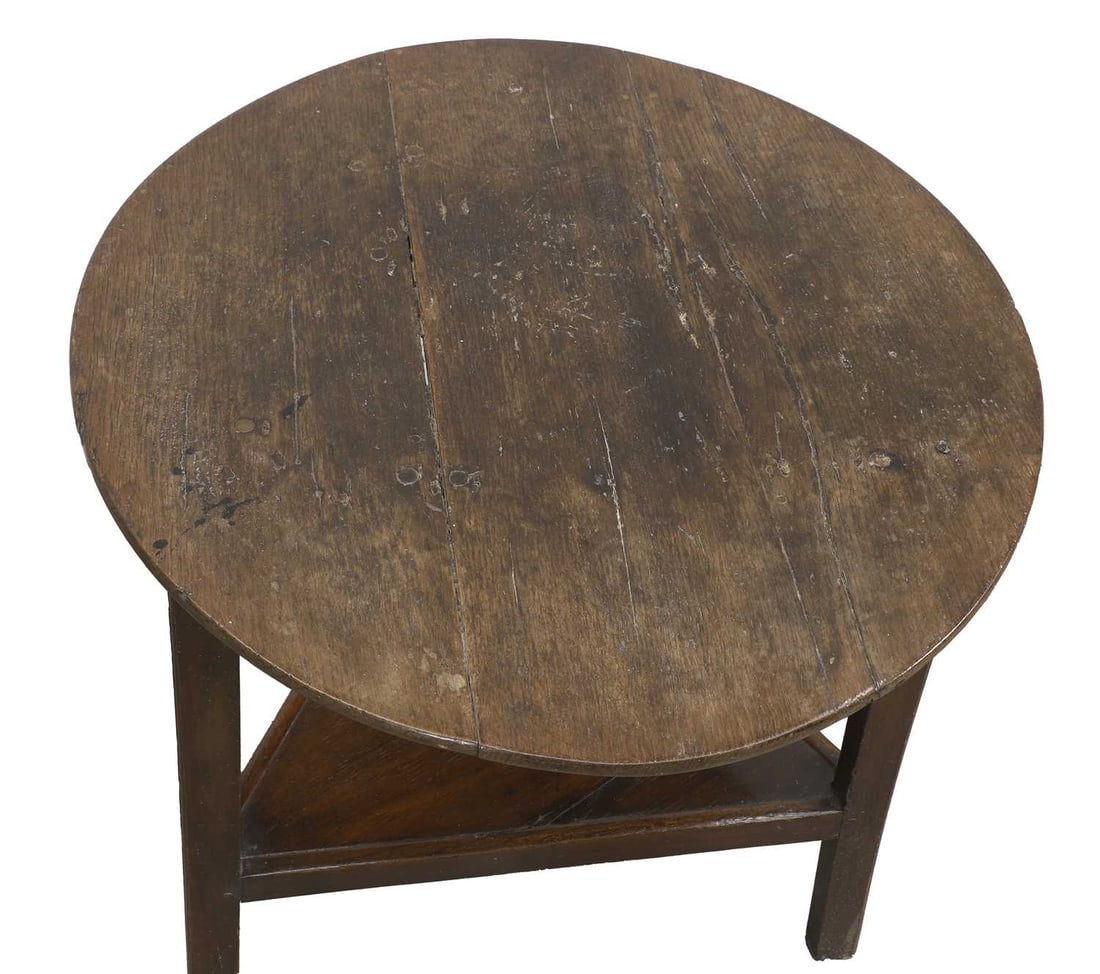 A George III oak two tier cricket table, - 2